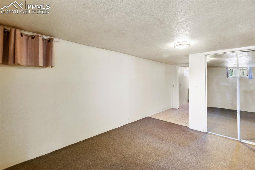 Image 20 of 34: Basement apartment bedroom