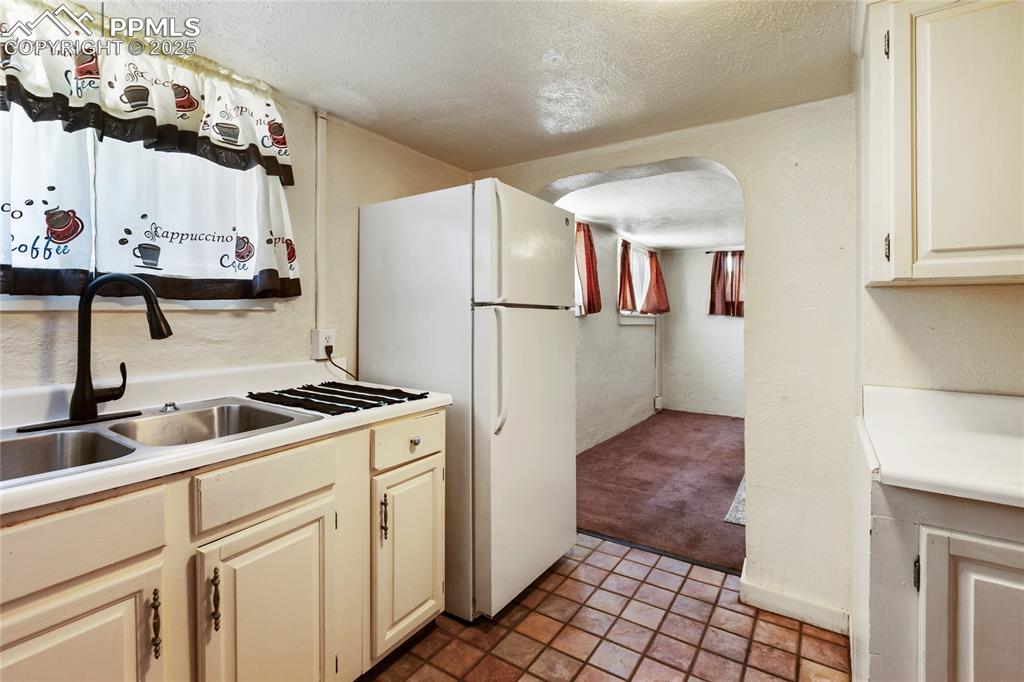 Image 24 of 34: Basement apartment kitchen