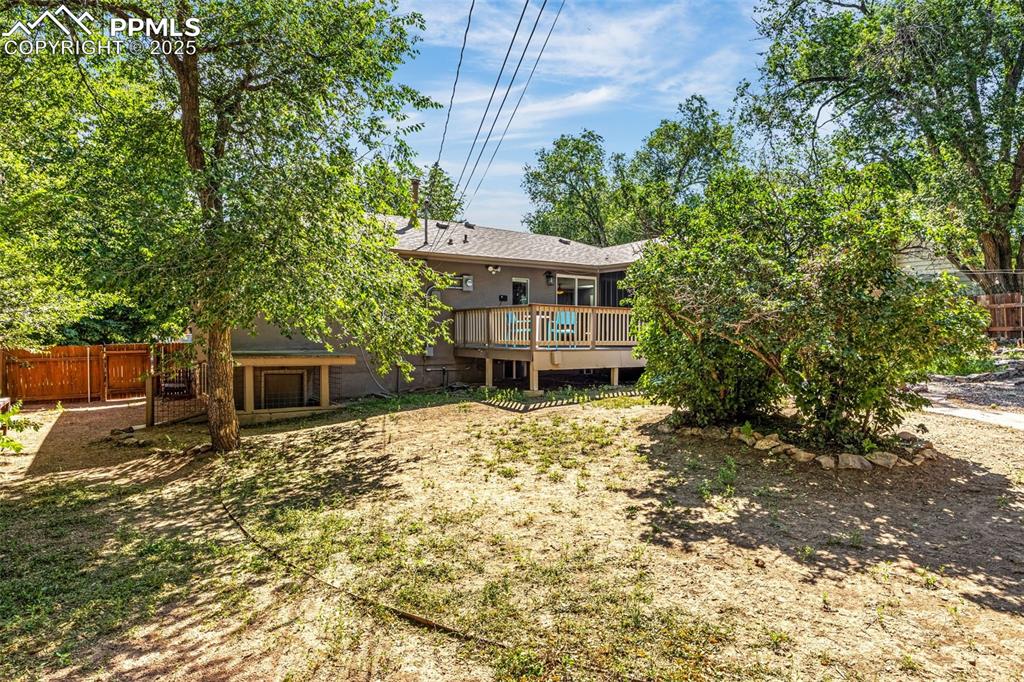 Image 32 of 42: Back of property featuring a deck