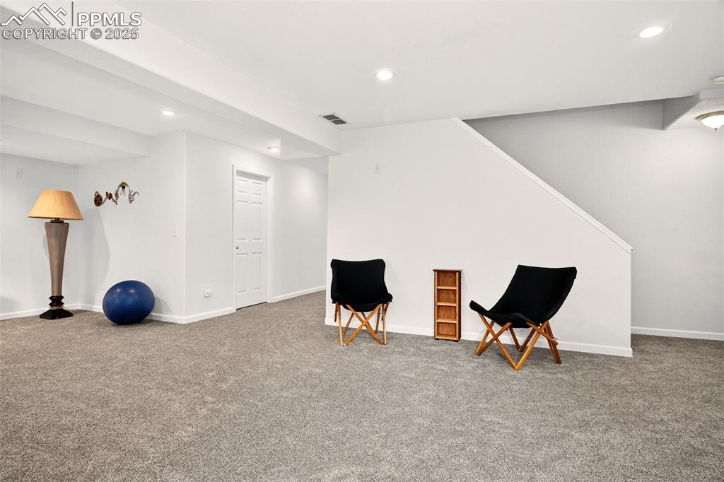 Image 25 of 40: Sitting room featuring recessed lighting and light carpet