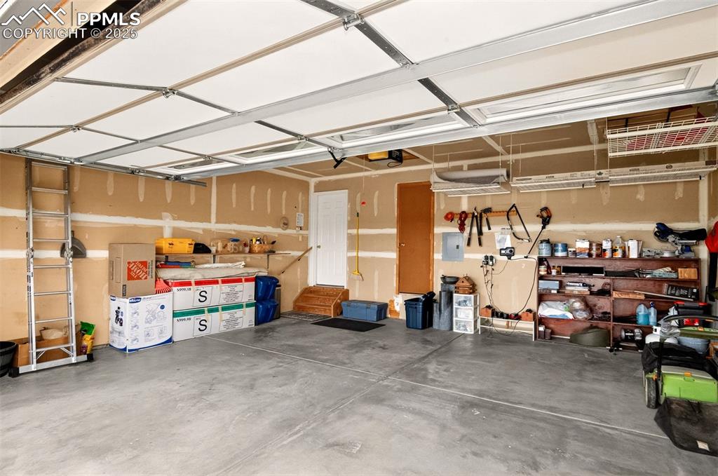 Image 32 of 40: Garage with electric panel