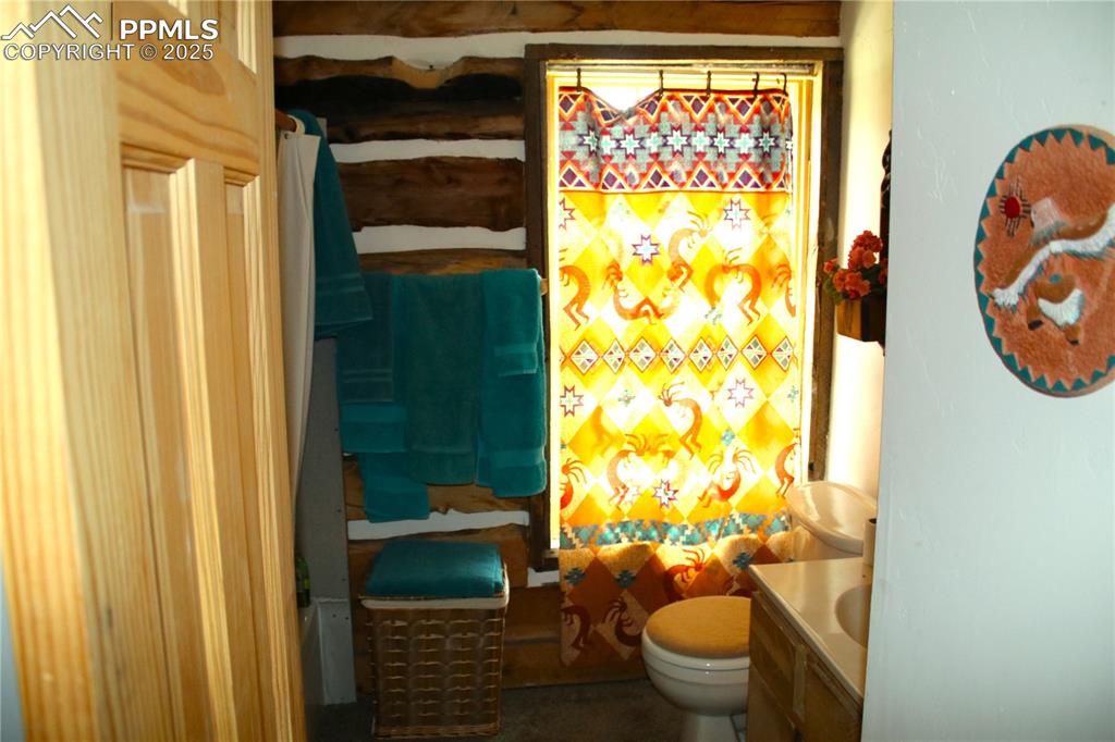 Image 24 of 28: Full bath featuring vanity and toilet