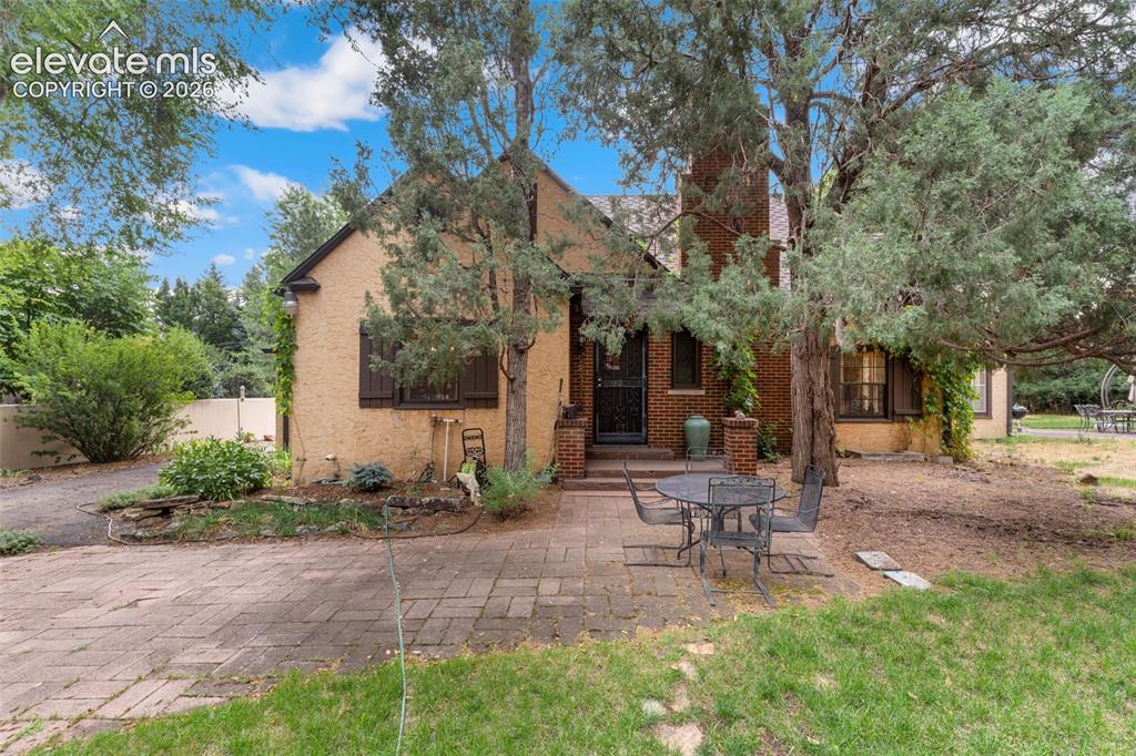 Caption: Front of house with large front patio