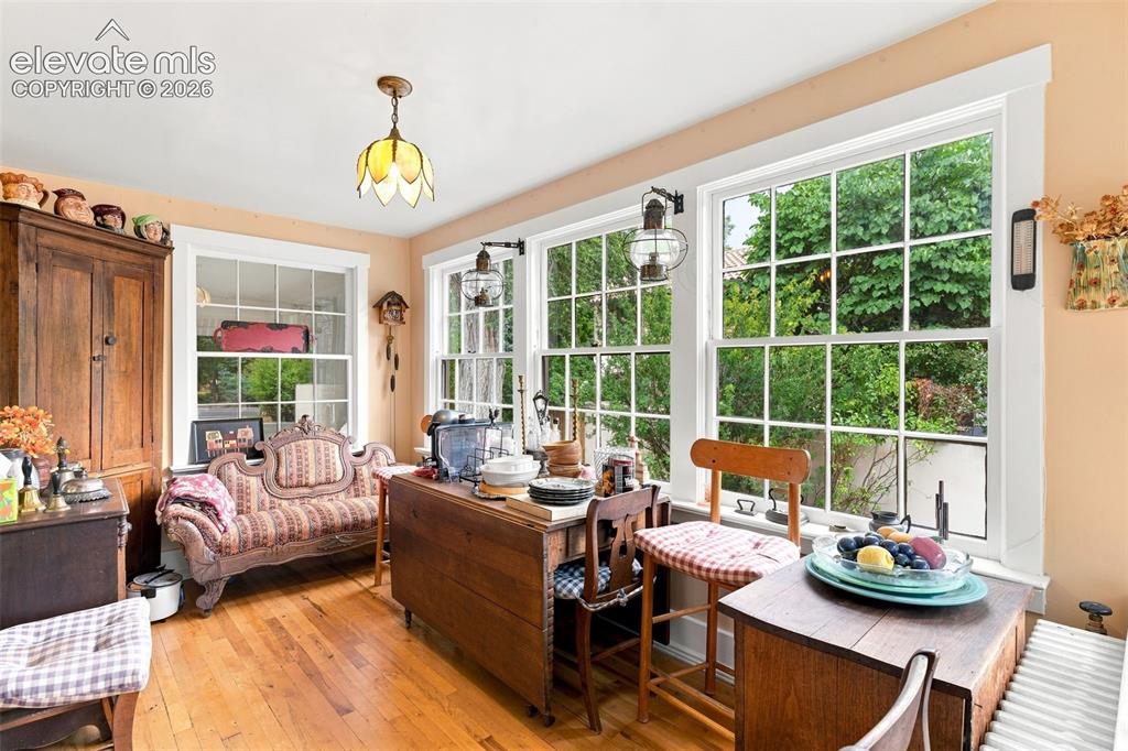 Image 18 of 50: Sunroom off Kitchen with walkout to Back door