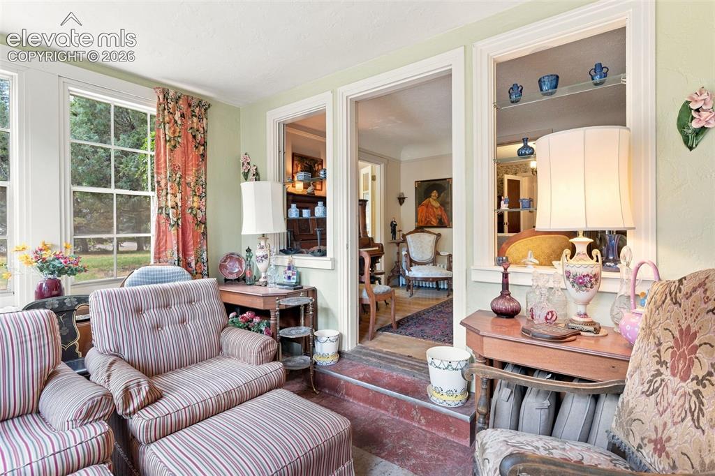 Image 21 of 50: Sunroom off Music Room with walkout to back patio