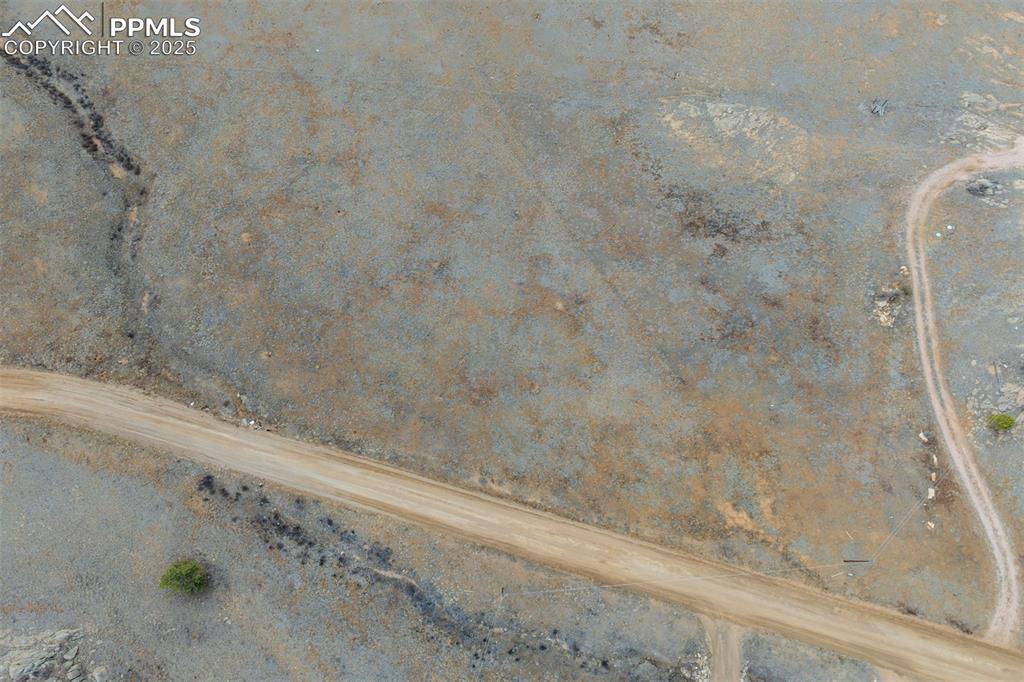 Image 3 of 17: Photo shows both vacant lots available. This listing is for the lot on the 
