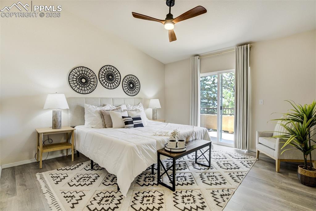 Image 17 of 39: Primary Suite on the main level with direct access to the balcony. 