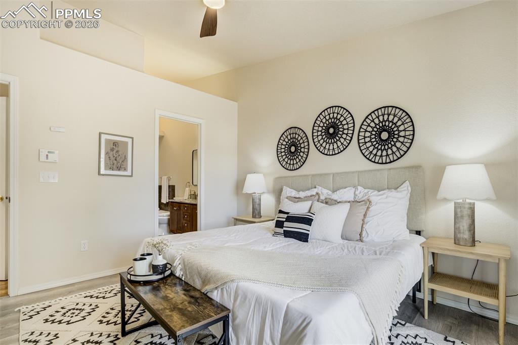 Image 19 of 39: New flooring and vaulted ceilings in the Primary bedroom. 