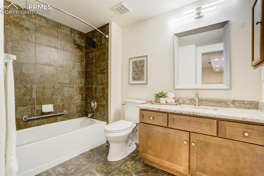 Image 34 of 39: Full bathroom in the basement. 