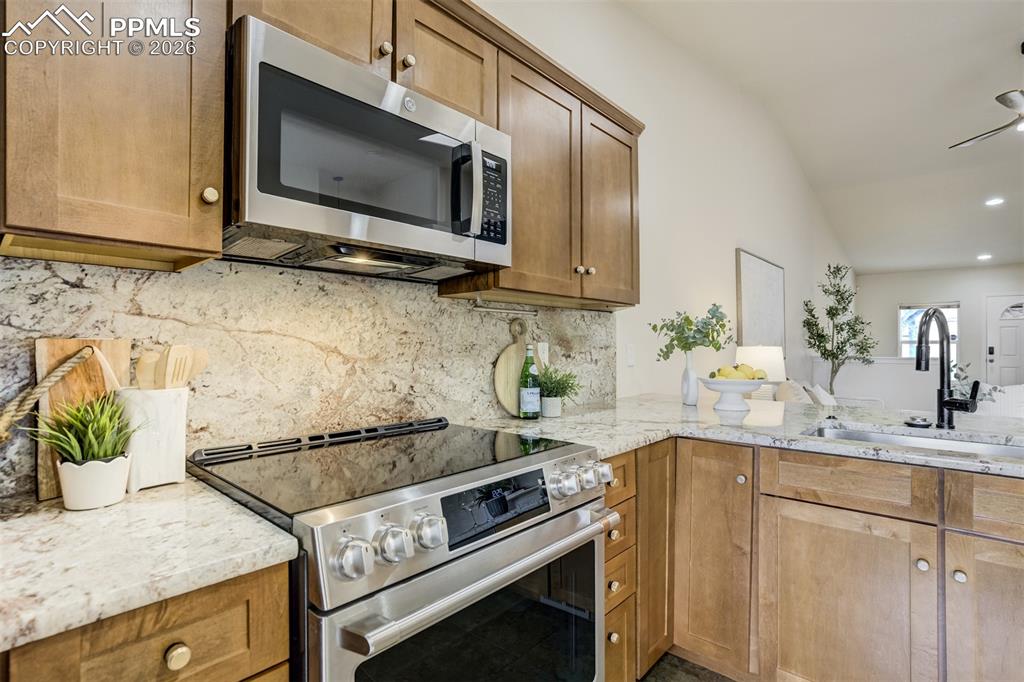Image 6 of 39: New cabinets with a new stove. 
