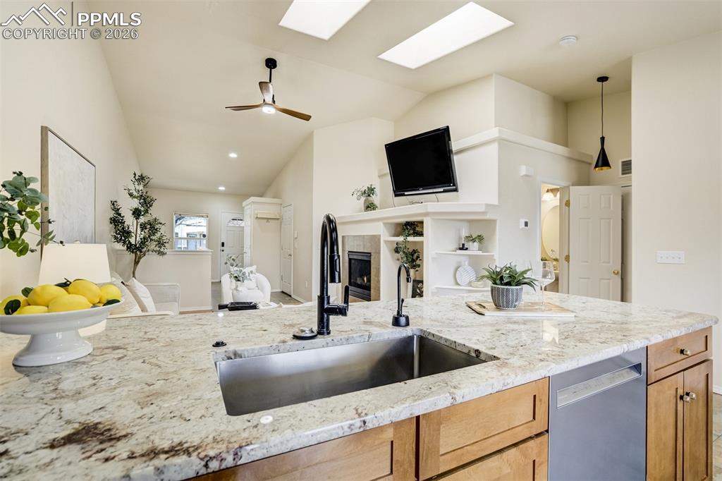 Image 7 of 39: New slab granite counters with a single-bowl stainless steel sink (life cha