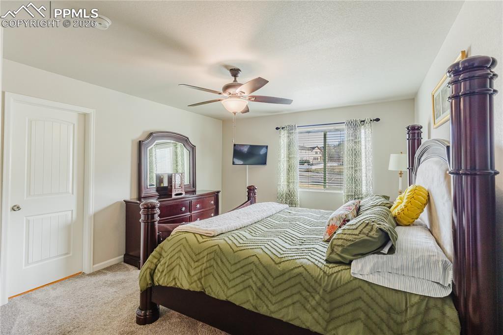 Image 11 of 26: Dining space featuring hanging lights, ceiling fan, and light wood finished