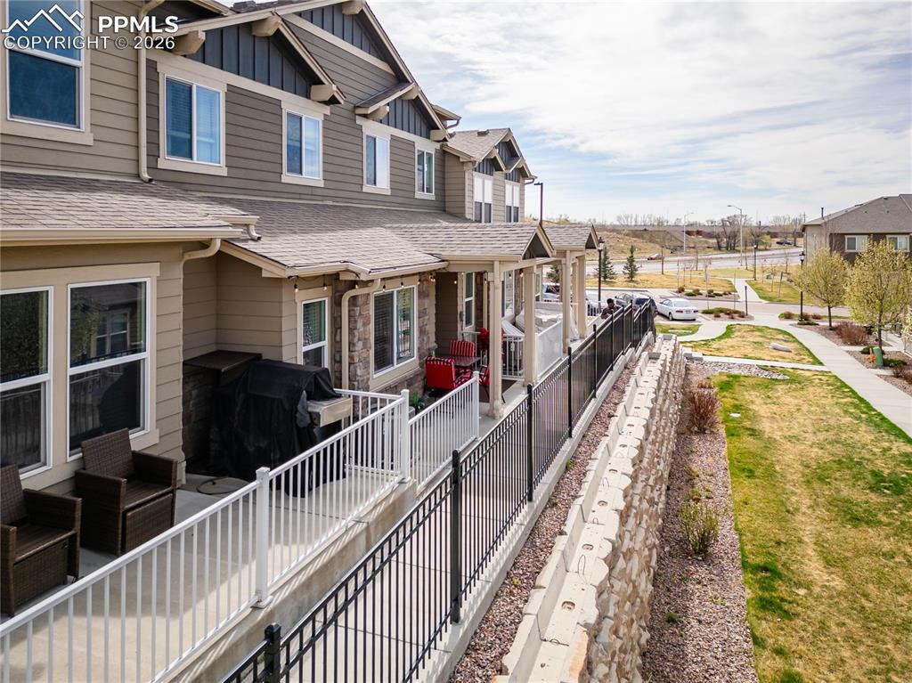 Image 22 of 26: Garage featuring a garage door opener
