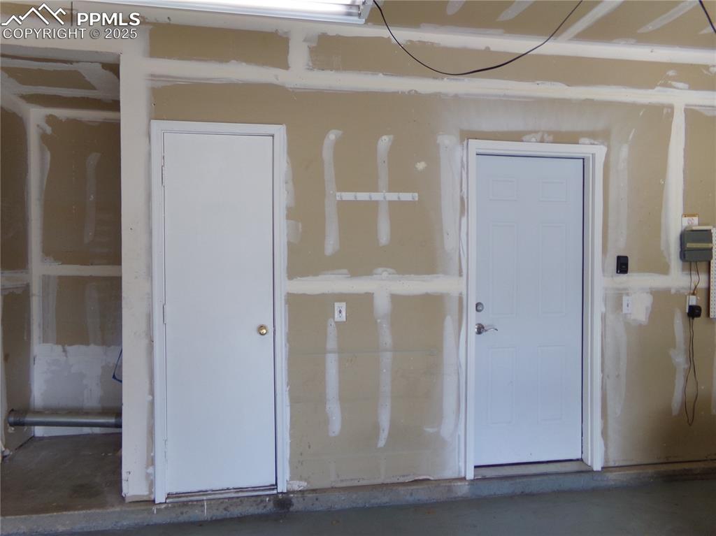 Image 26 of 29: Miscellaneous room featuring concrete flooring