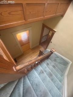 Image 18 of 50: Staircase featuring baseboards