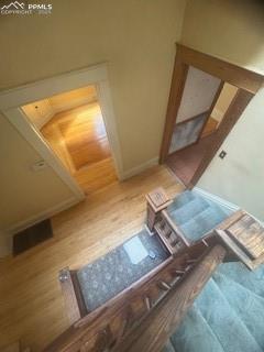 Image 19 of 50: Stairs with wood finished floors