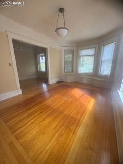 Image 20 of 50: Empty room with hardwood / wood-style floors