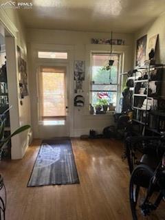 Image 30 of 50: Entrance foyer with wood finished floors and a textured ceiling