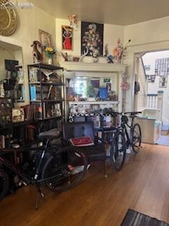 Image 31 of 50: Living area with wood finished floors