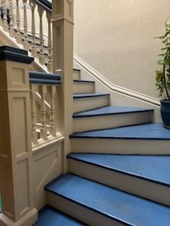 Image 32 of 50: Stairway with a textured wall