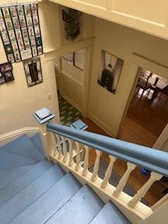 Image 37 of 50: Stairs featuring baseboards