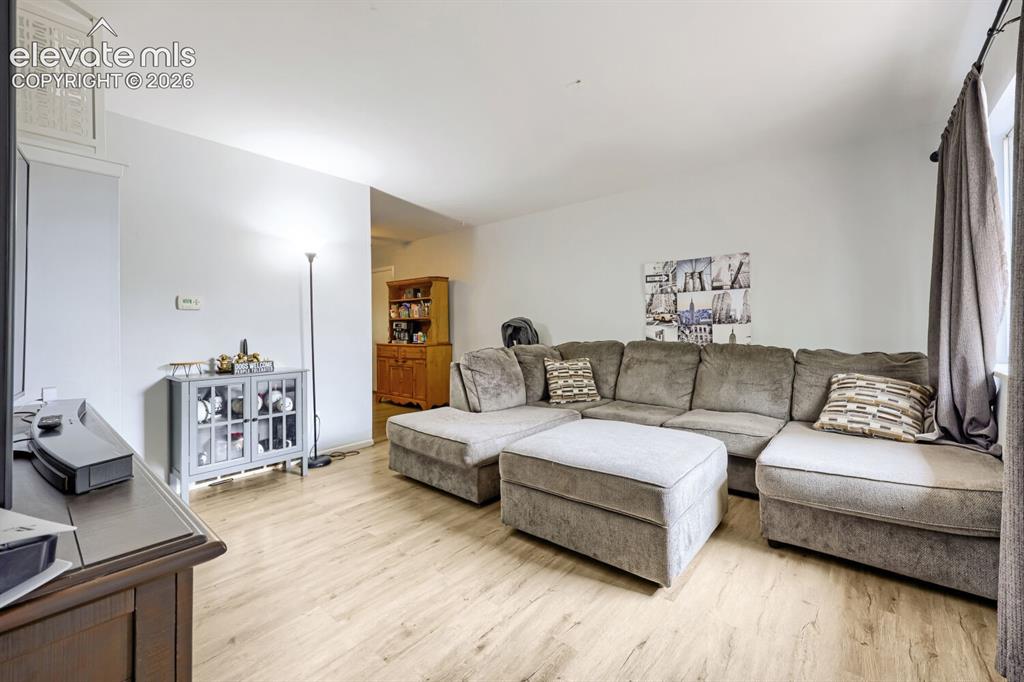 Image 2 of 26: Light wood-finish flooring throughout
