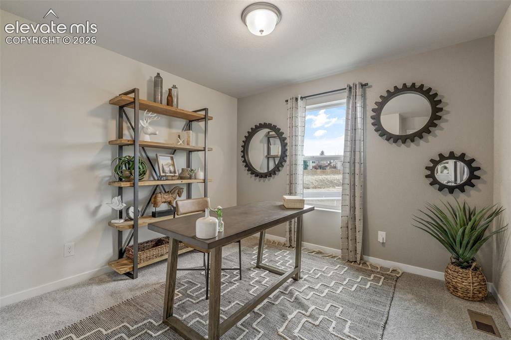 Image 24 of 26: Recessed lighting, light-toned wall paint, a window with natural light, and