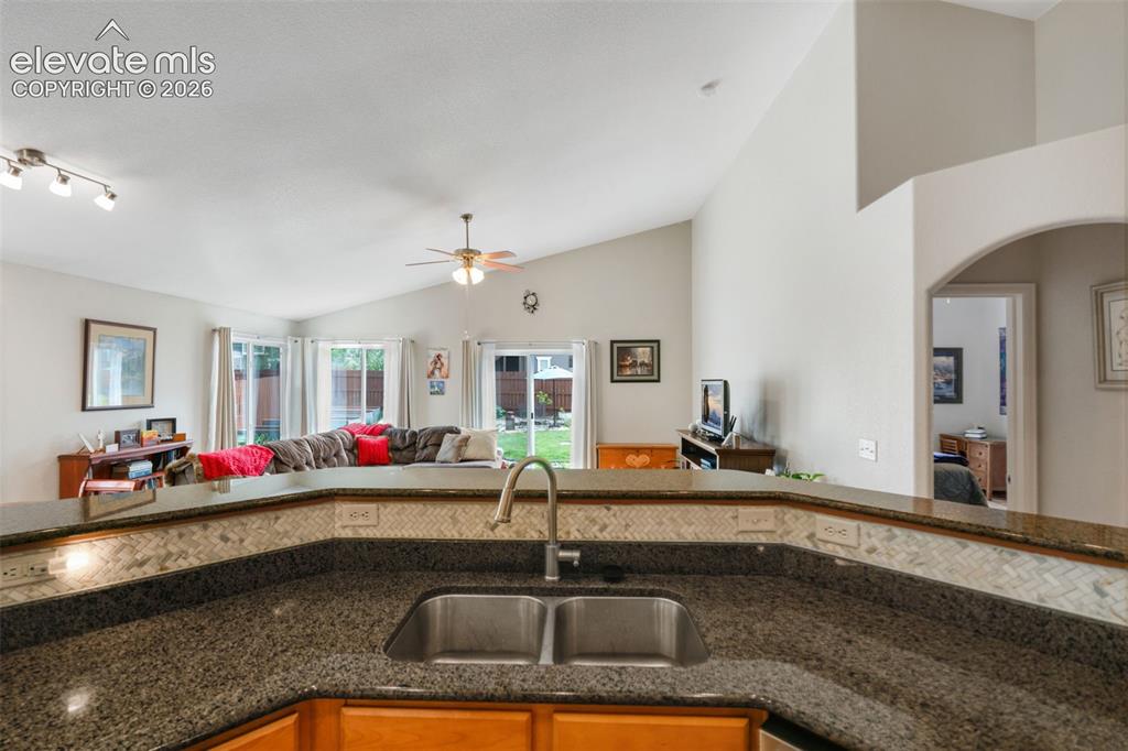Image 17 of 46: Spacious Living Room with large windows for plenty of natural light