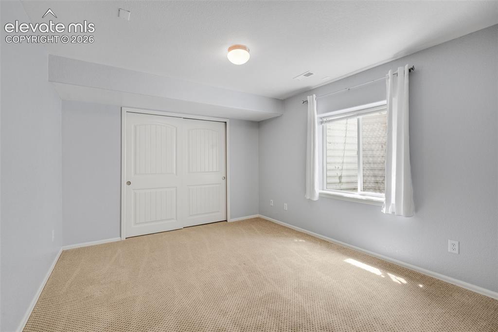 Image 28 of 46: Huge Family/Rec Room with high ceilings and 3 large windows