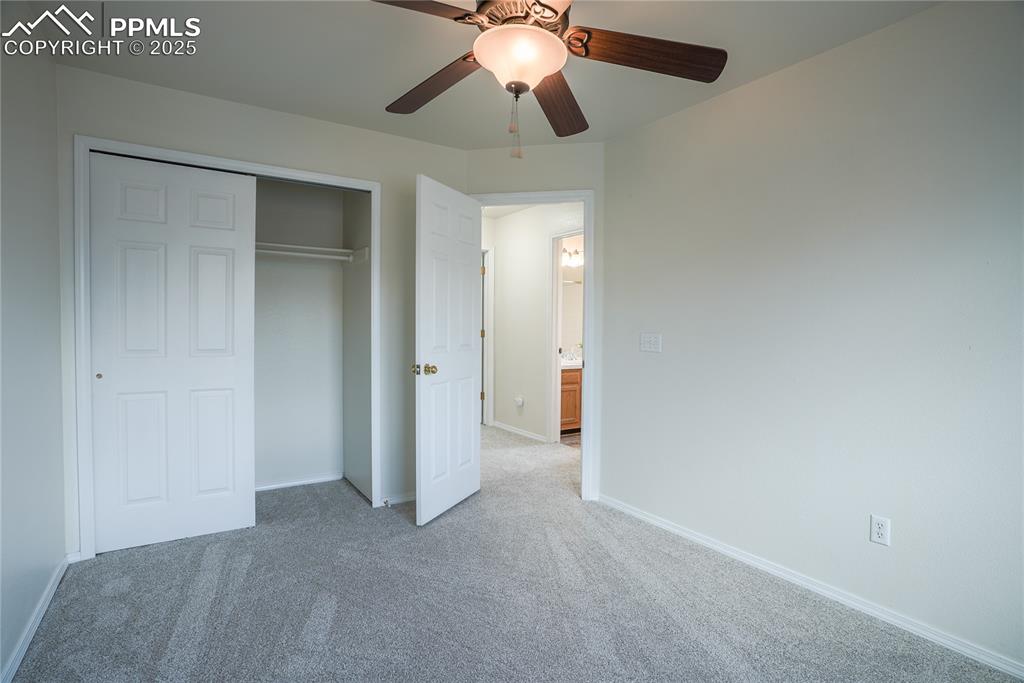 Image 10 of 37: Unfurnished bedroom featuring carpet floors, a ceiling fan, and a closet