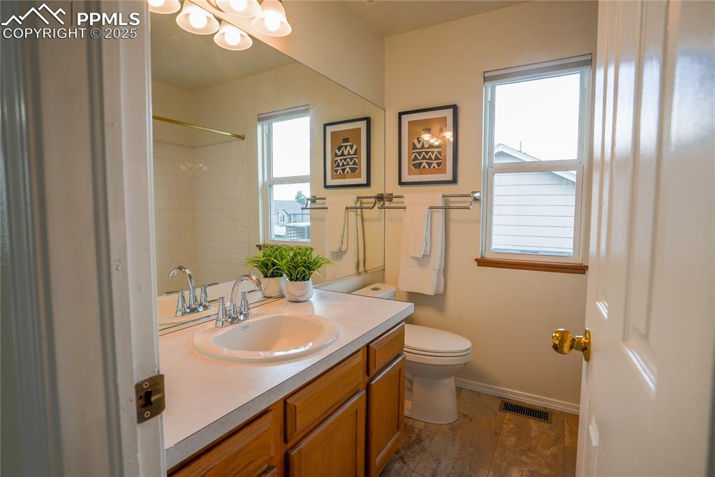 Image 11 of 37: Full bathroom featuring vanity and a shower