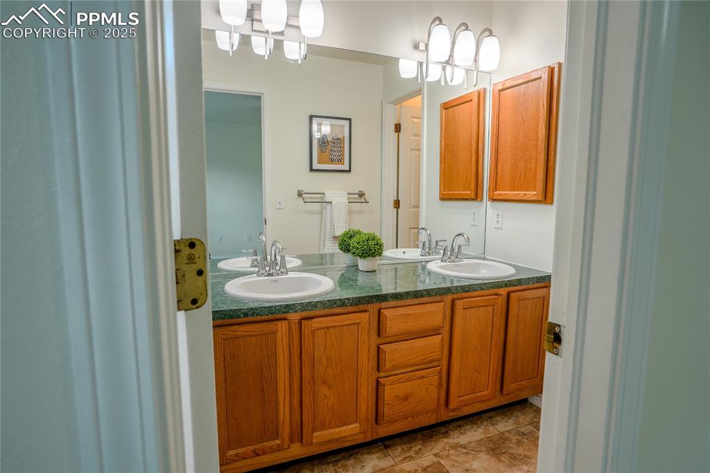 Image 14 of 37: Full bathroom with double vanity
