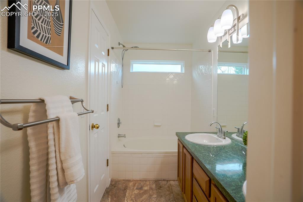 Image 15 of 37: Full bathroom featuring shower / bath combo and vanity