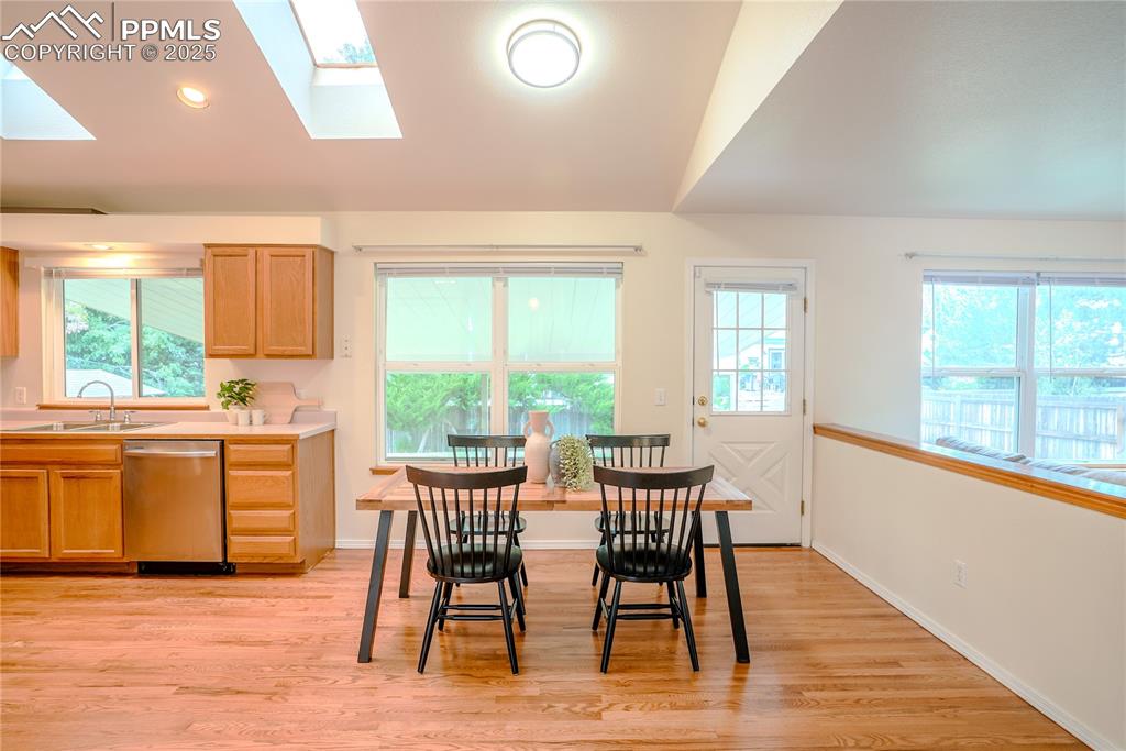 Image 20 of 37: Dining space with door to backyard