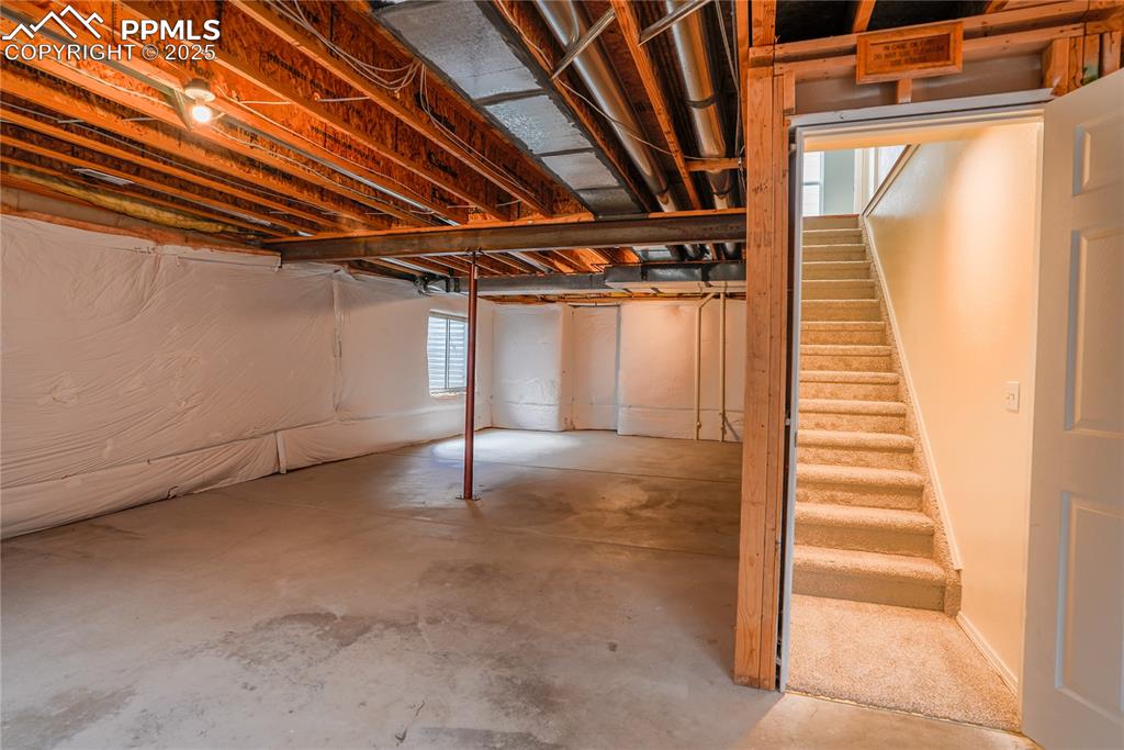 Image 28 of 37: Basement featuring stairs