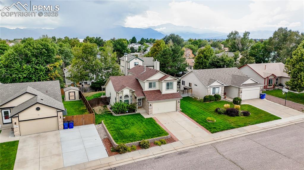 Image 31 of 37: Aerial perspective of suburban area with mountains