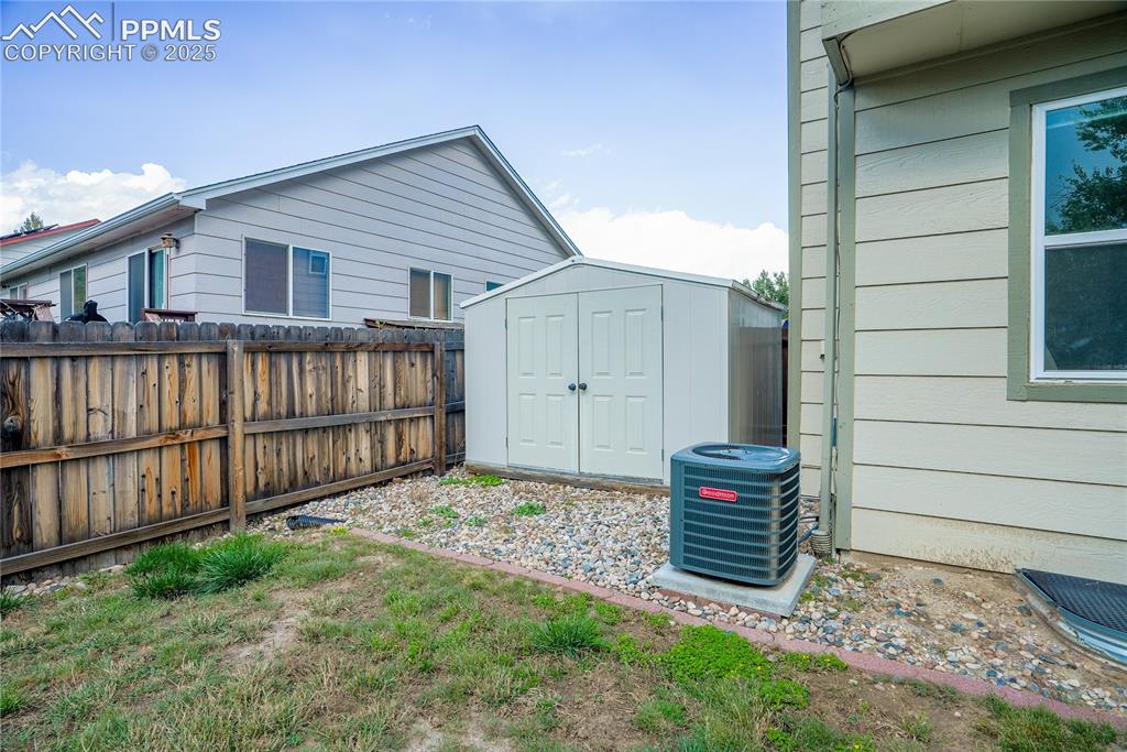 Image 34 of 37: View of yard featuring a shed