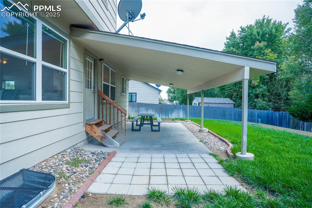Image 36 of 37: View of patio featuring entry steps