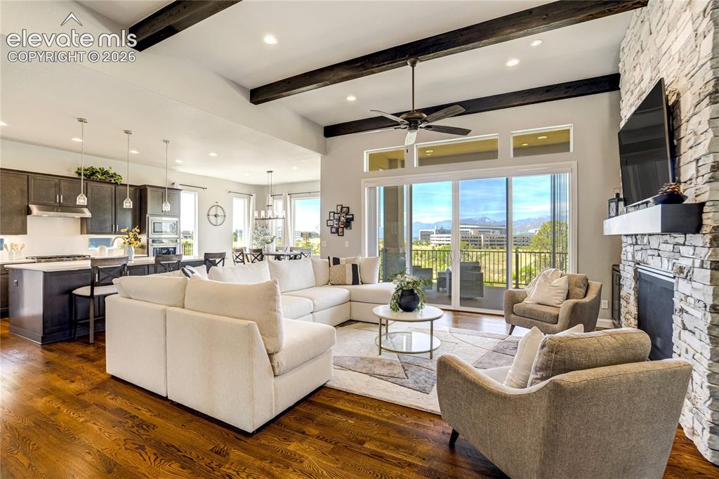 Image 6 of 50: Expansive ceilings, wood beams, walls of glass, and a floor-to-ceiling ston