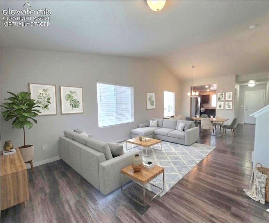Image 6 of 35: Virtually staged living room and dining room