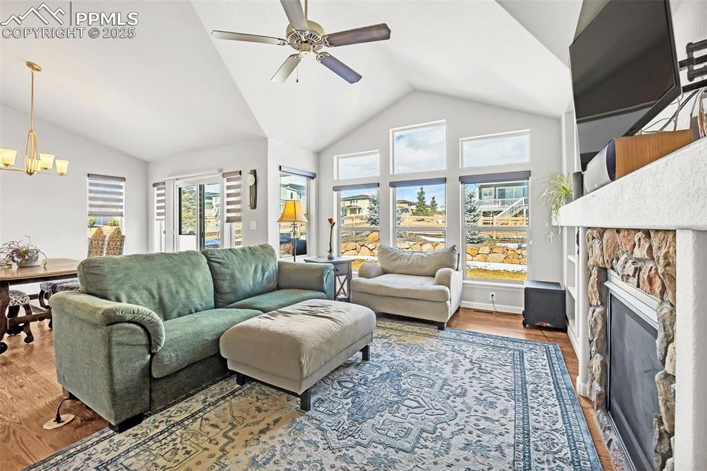 Image 10 of 45: Living area with a fireplace, and wood finished floors
