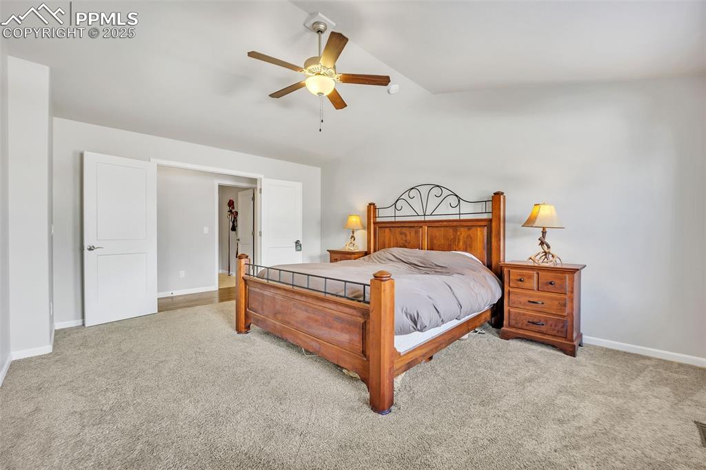 Image 13 of 45: Bedroom with vaulted ceiling