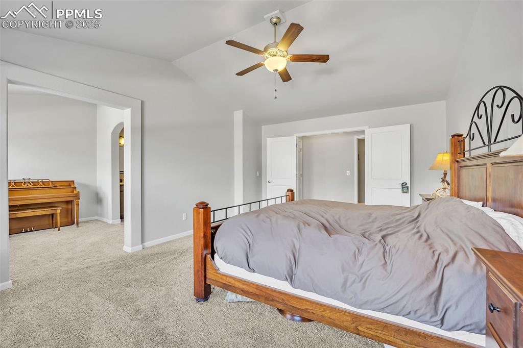 Image 14 of 45: Bedroom featuring lofted ceiling