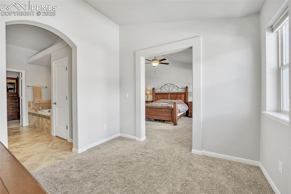 Image 15 of 45: Private sitting/dressing room off of primary bedroom