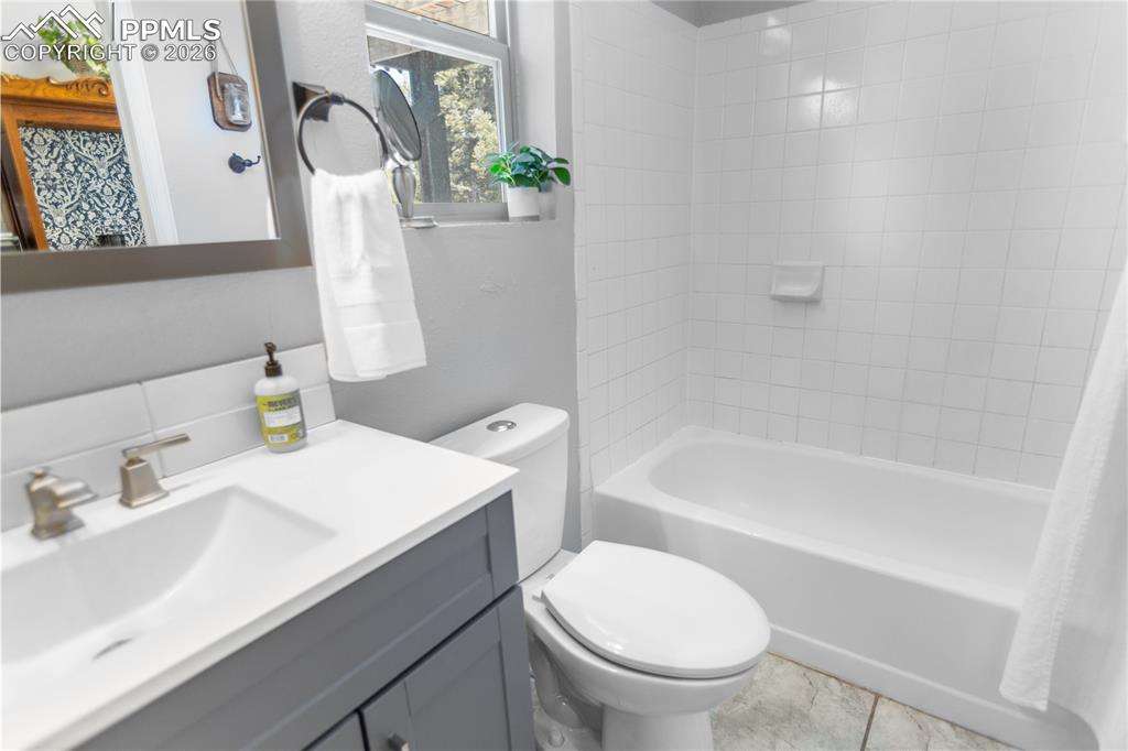 Image 12 of 29: Main level bath