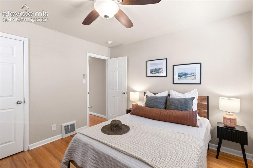 Image 24 of 47: Bedroom featuring wood-finish flooring, a ceiling fan with integrated light