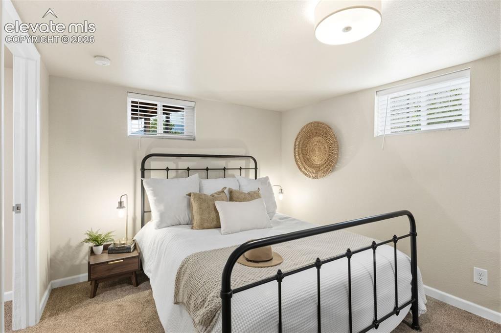 Image 25 of 47: Bedroom featuring neutral-toned walls and carpet flooring