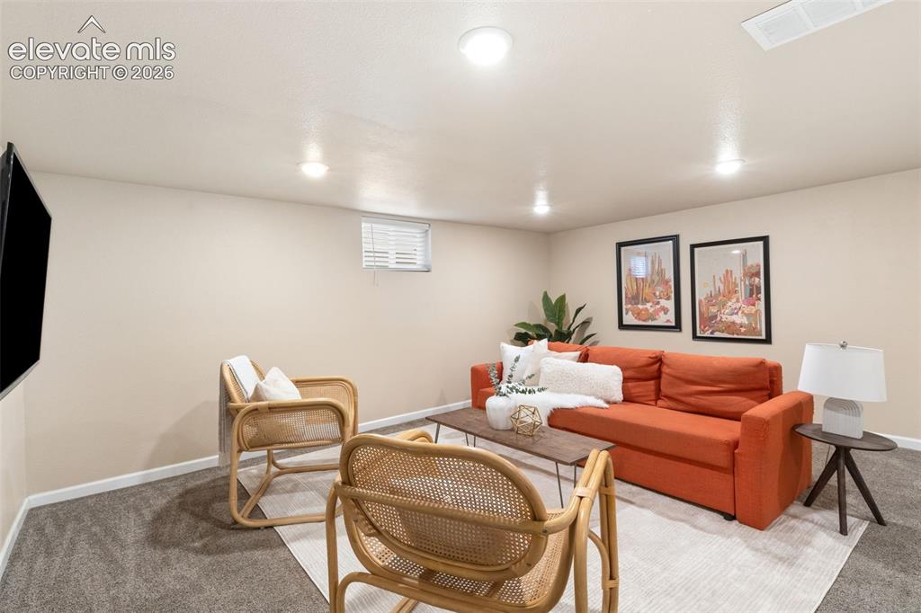 Image 30 of 47: Recreational space featuring recessed lighting, a mounted television, a sin