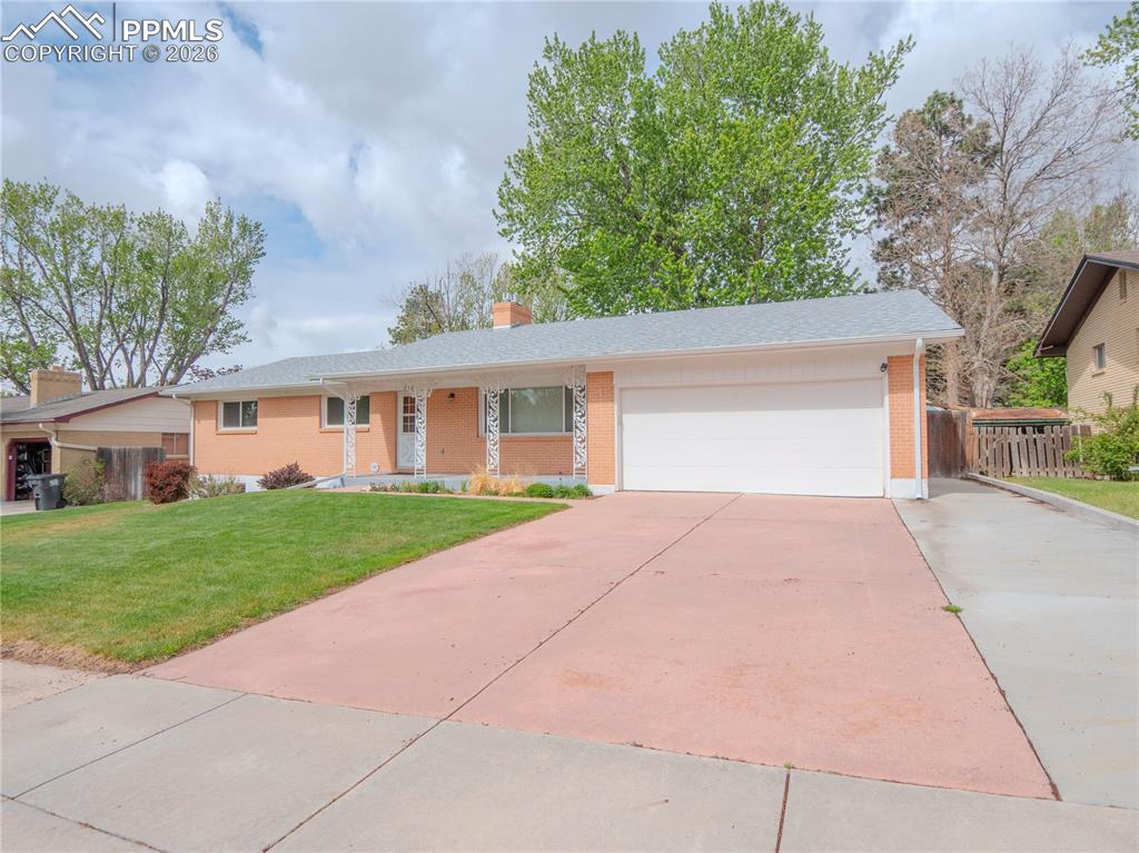 Image 1 of 29: Ranch-style residence featuring a brick facade, attached two-car garage, co