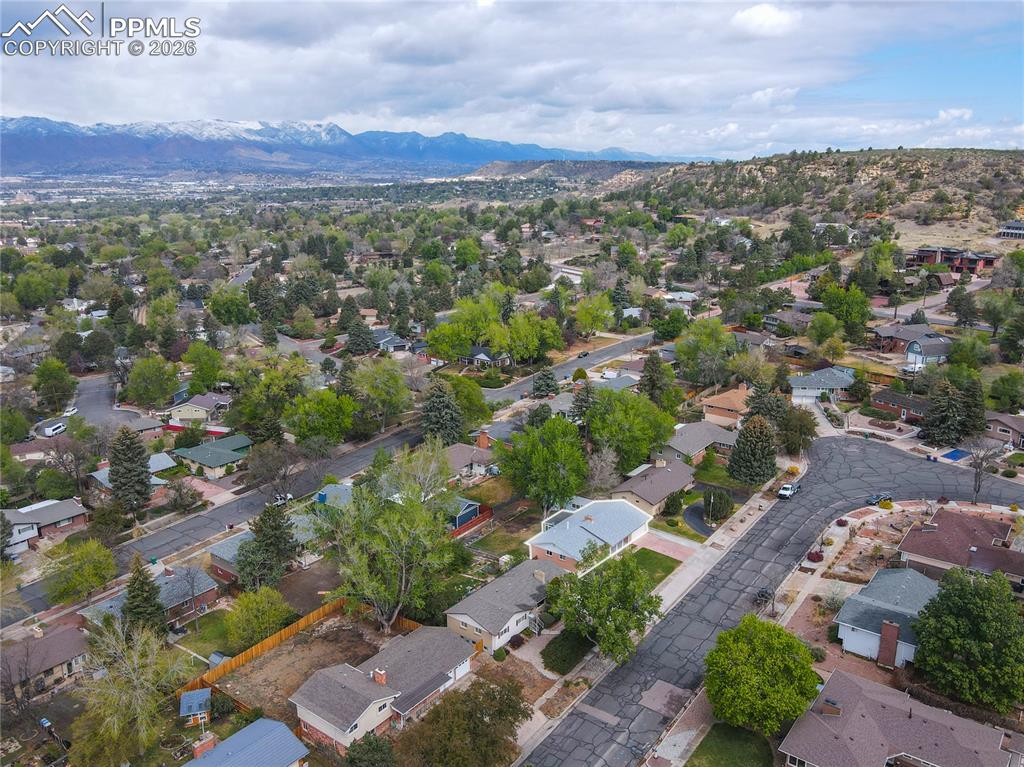 Image 29 of 29: Expansive residential neighborhood featuring mature trees and a varied arch